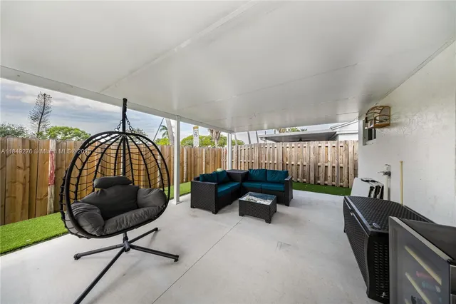 a living room with furniture and a chair