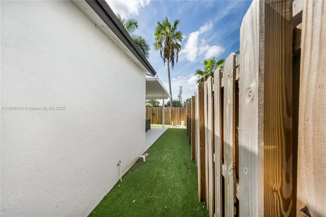 a view of a hallway with a door