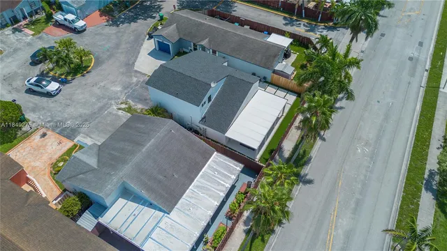 an aerial view of a house with outdoor space