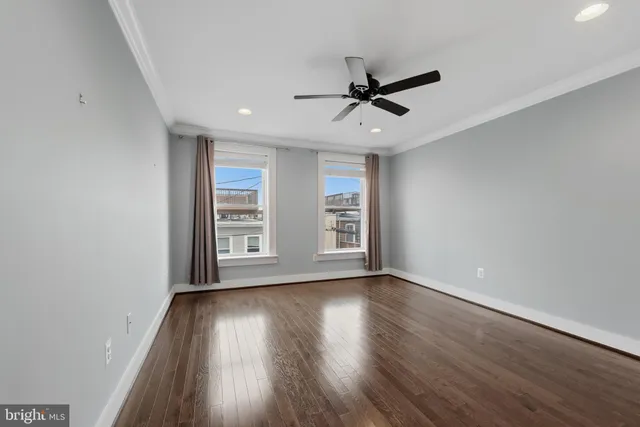 a view of room window and wooden floor