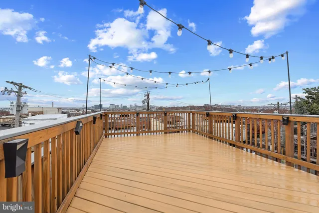 a view of a balcony with dining table