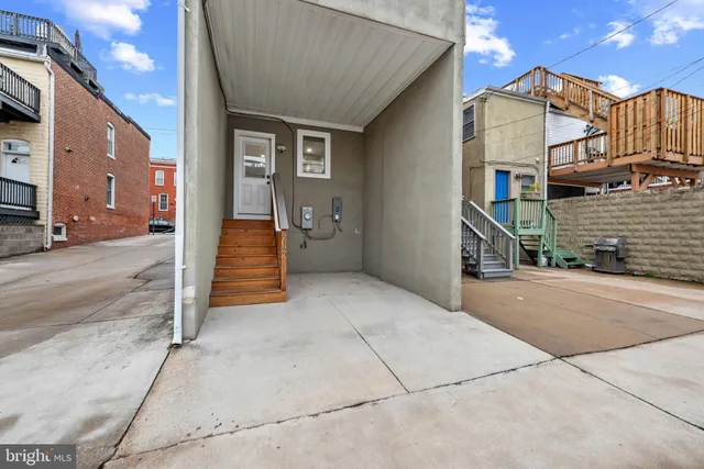 a view of a house with a street