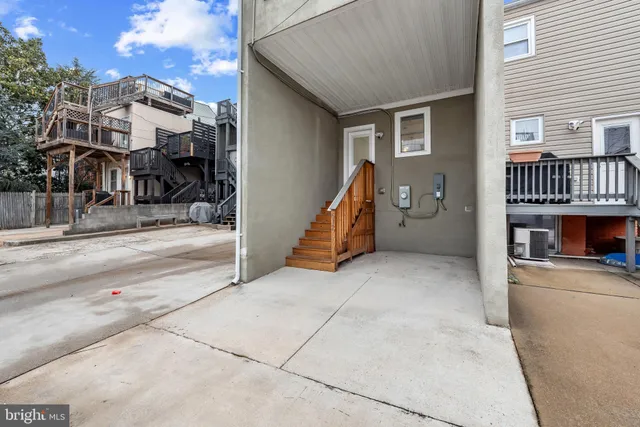 a view of a house with a barbeque