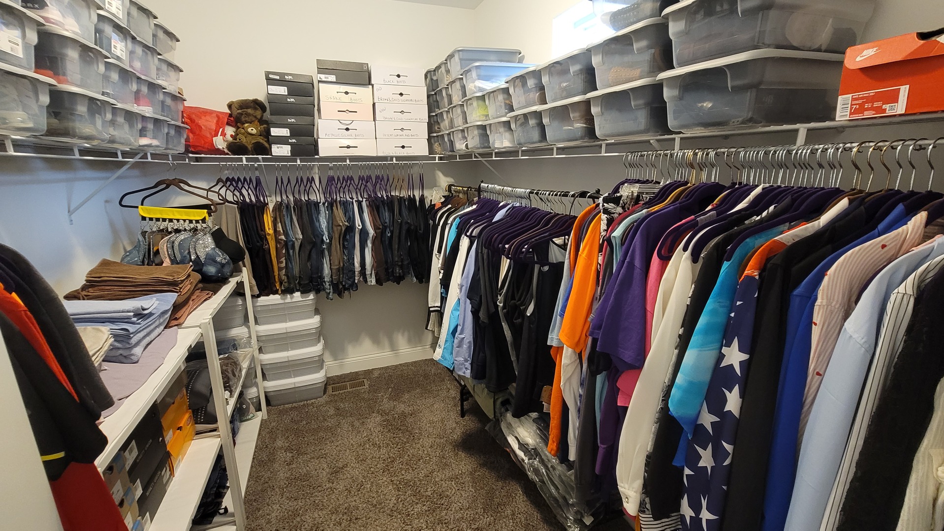 1919 Truman Street Sycamore, IL 60178 - Photo 20 of 50 a view of walk in closet with clothes and shoes