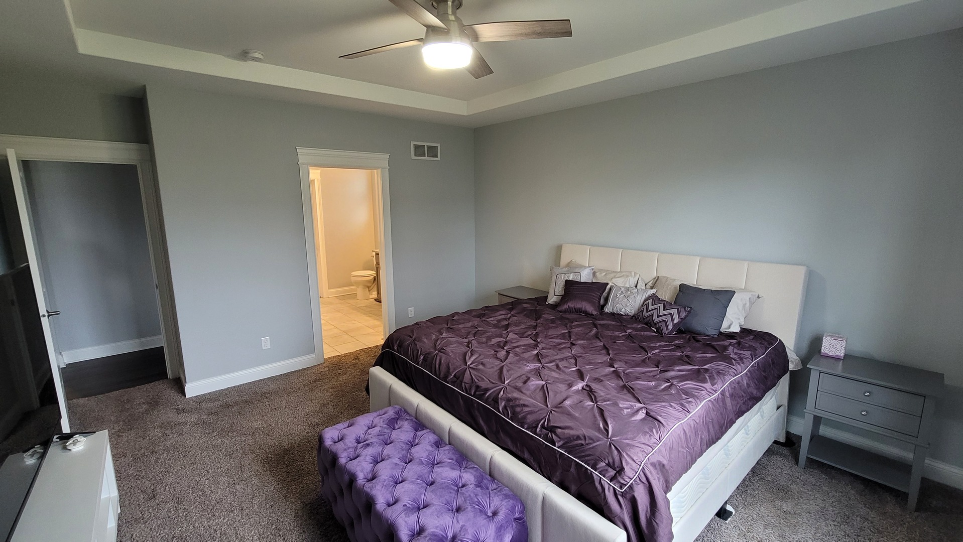 1919 Truman Street Sycamore, IL 60178 - Photo 23 of 50 a bedroom with a large bed and a chandelier