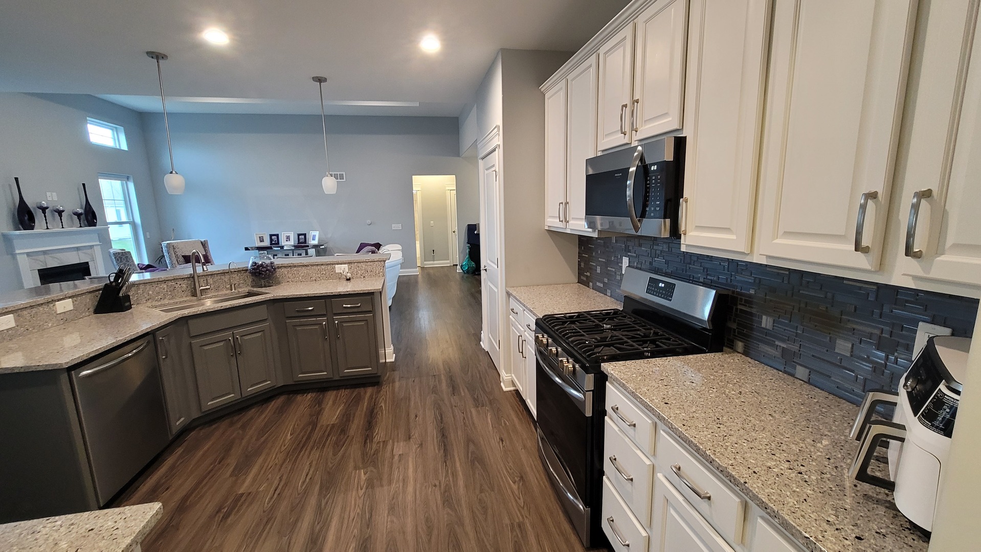 1919 Truman Street Sycamore, IL 60178 - Photo 29 of 50 a kitchen with a sink stove and microwave