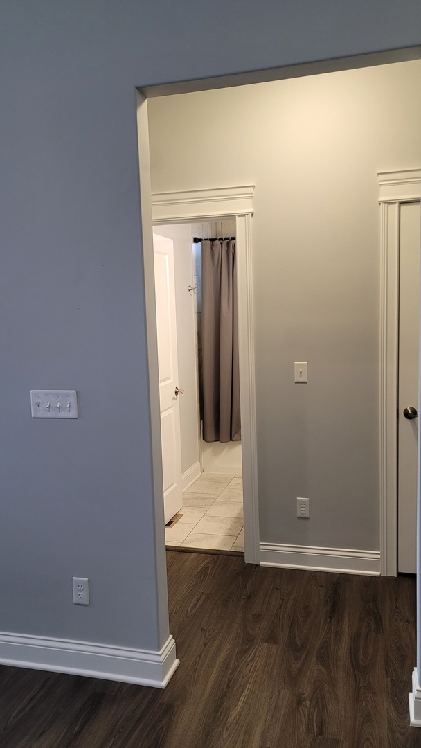 1919 Truman Street Sycamore, IL 60178 - Photo 34 of 50 an empty room with wooden floor and closet