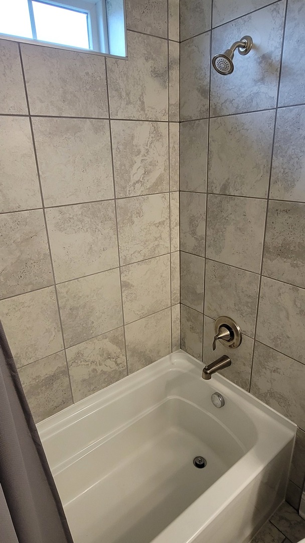 1919 Truman Street Sycamore, IL 60178 - Photo 36 of 50 a bathroom with a bathtub