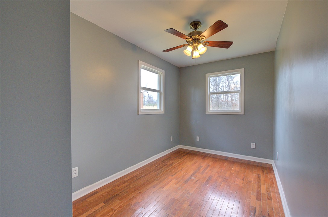 325 Rock Quarry Road Travelers Rest, SC 29690 - Photo 24 of 37 This bright room features durable hardwood flooring and large windows, creating an inviting atmosphere.