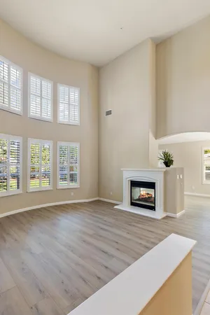 a kitchen with sink a microwave and cabinets