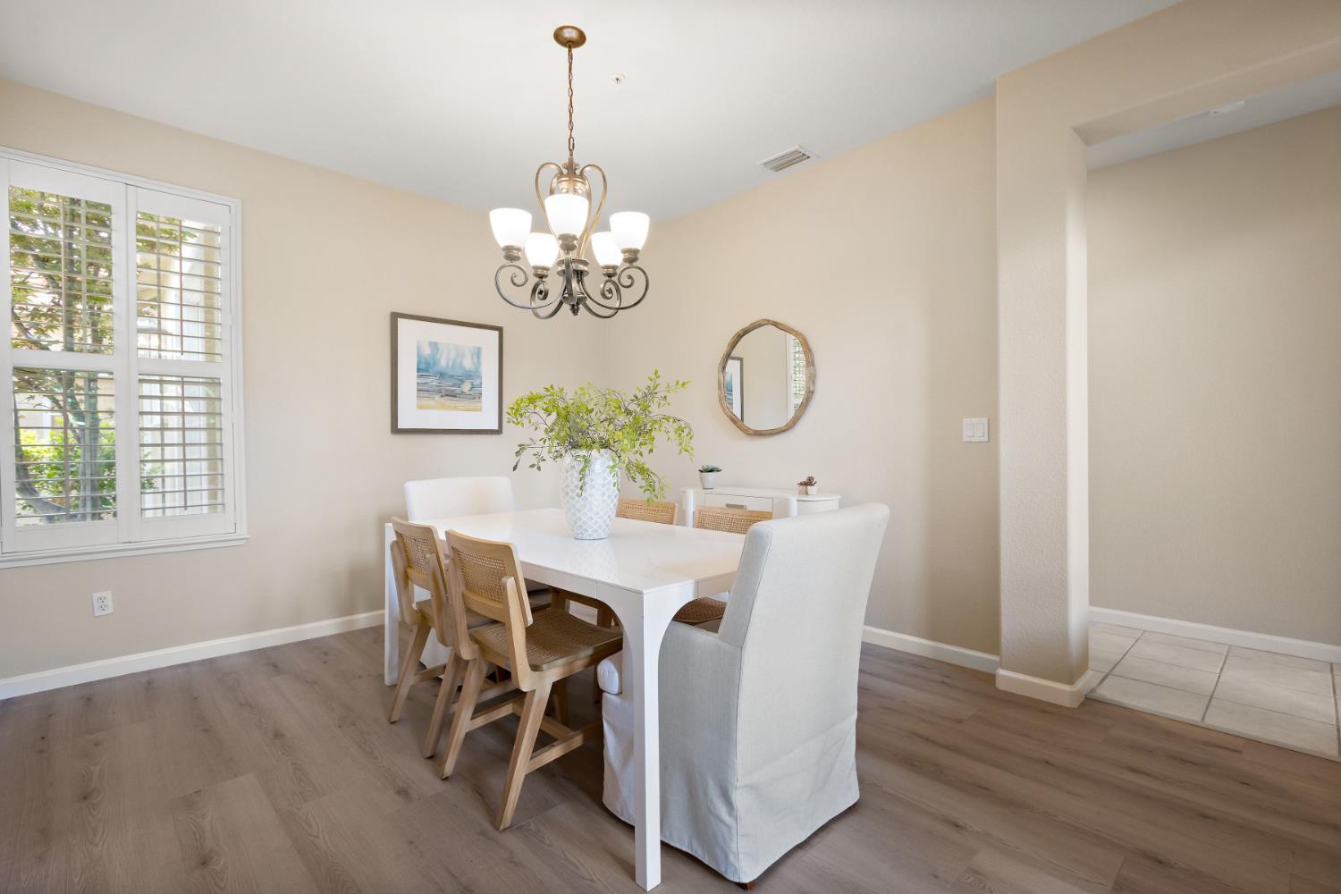 5631 Tufts Street Davis, CA 95618 - Photo 17 of 69 a view of a dining room with furniture a chandelier and wooden floor