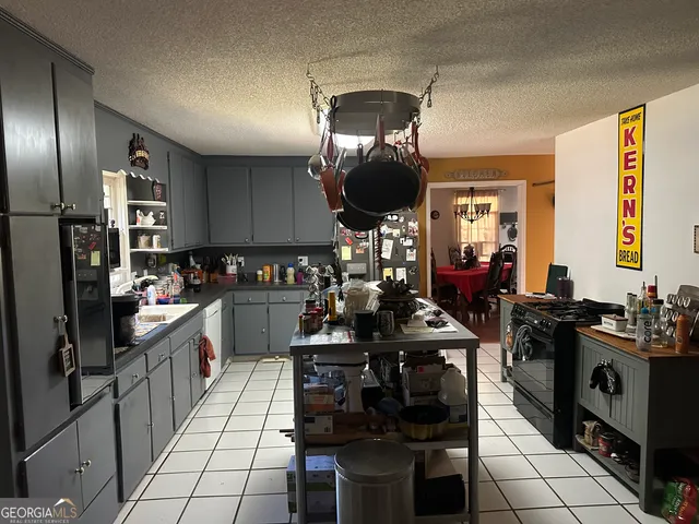 a kitchen with sink cabinets and stainless steel appliances