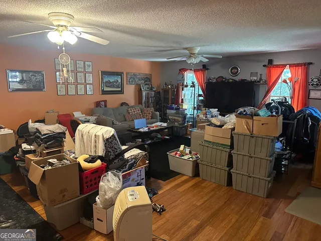 a room with furniture a flat screen tv and a fireplace