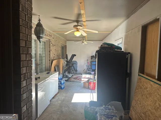 a view of living room with furniture and a chandelier