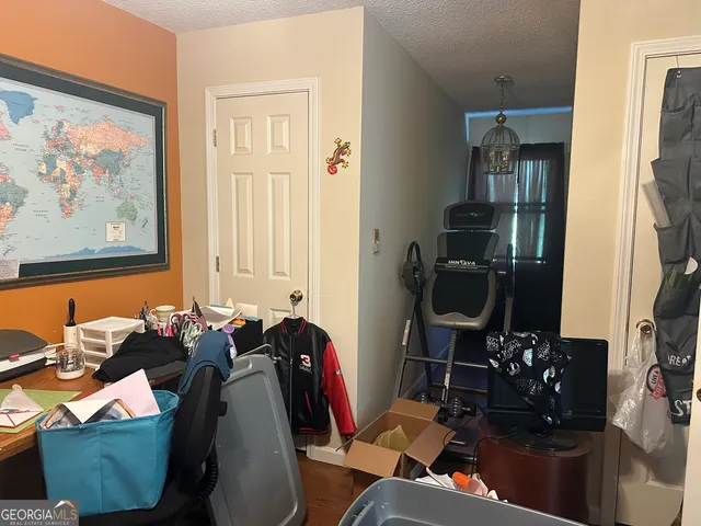 a room with furniture and musical instruments