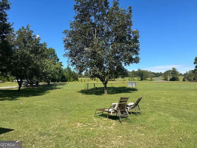 a view of a lake with a bench in the lake