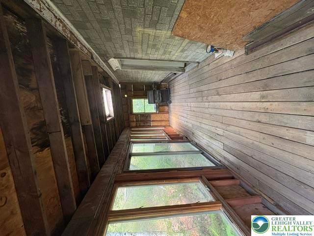 581 Mauch Chunk Road Palmerton, PA 18071 - Photo 20 of 27 Rustic wooden framing and natural light define this unique porch space awaiting your personal touch.