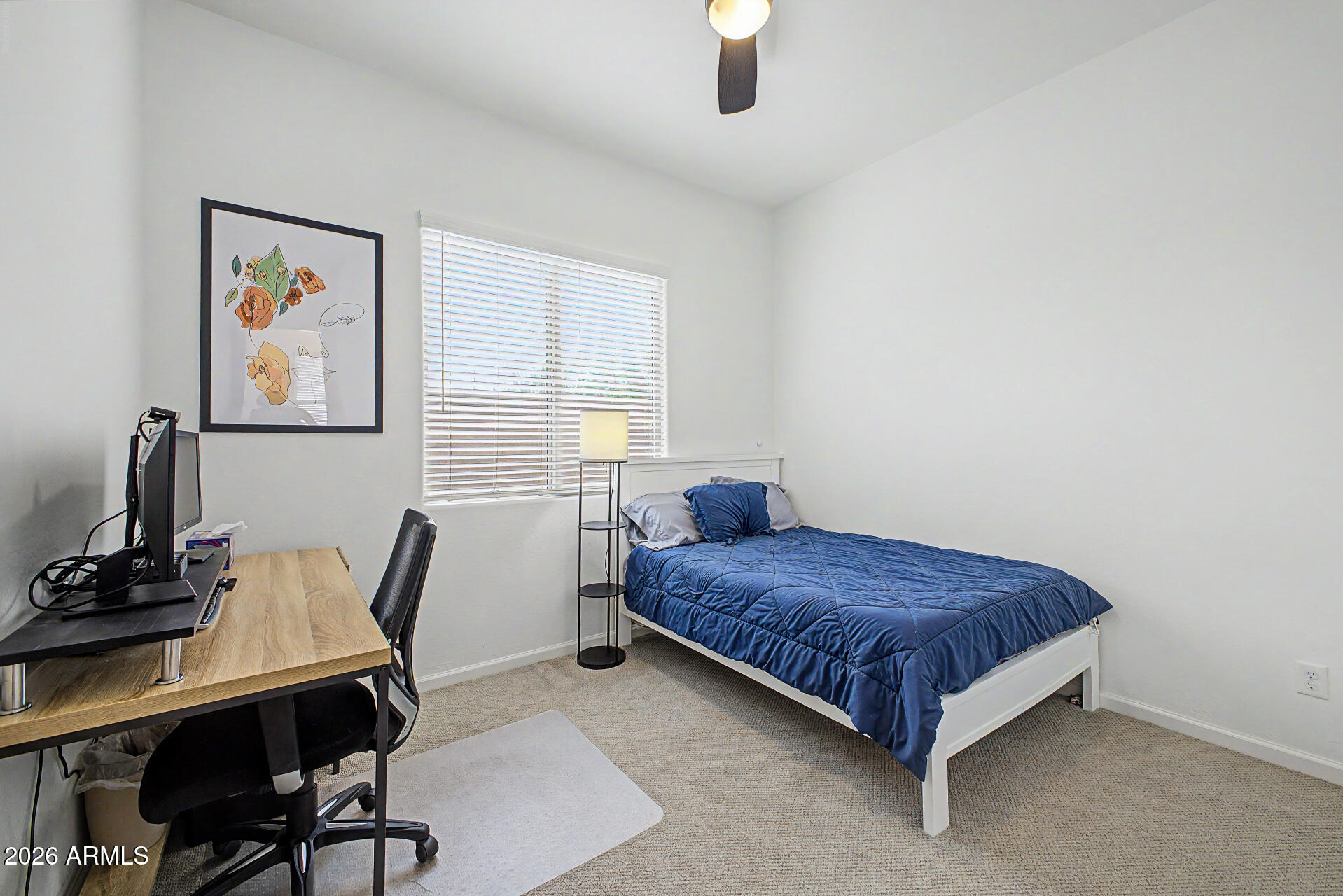 6511 West Steed Ridge Phoenix, AZ 85083 - Photo 21 of 41 a bedroom with a bed and a desk