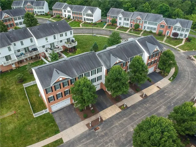 an aerial view of a house with a garden
