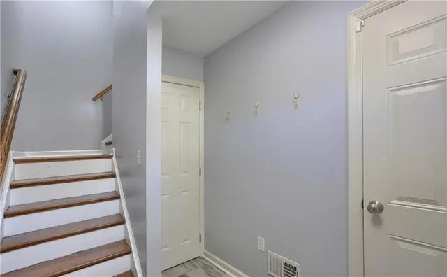 a view of entryway with wooden floor