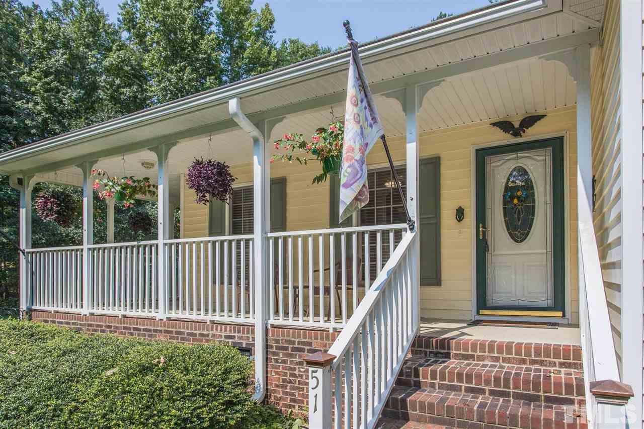 51 Hunters Lane Timberlake, NC 27583 - Photo 2 of 30 a view of a house with a porch