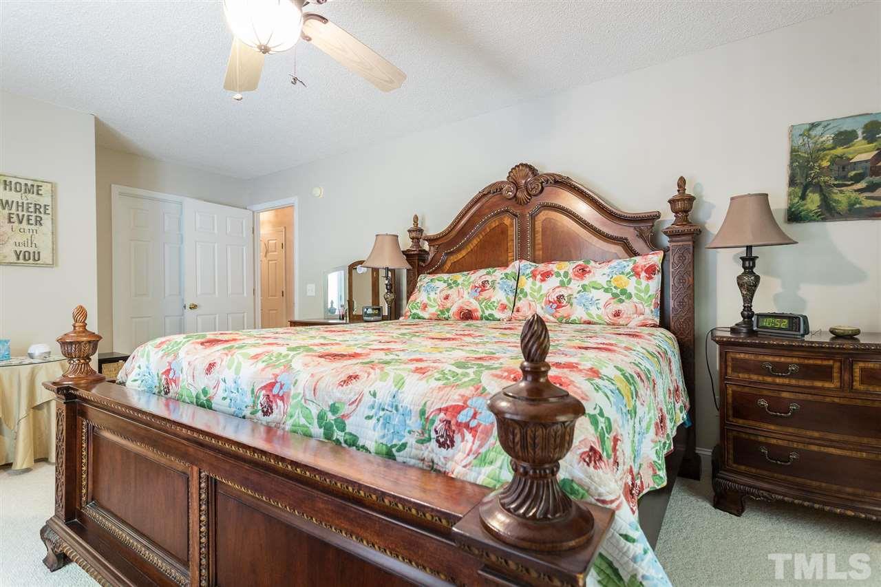 51 Hunters Lane Timberlake, NC 27583 - Photo 16 of 30 a bedroom with a bed and a dresser