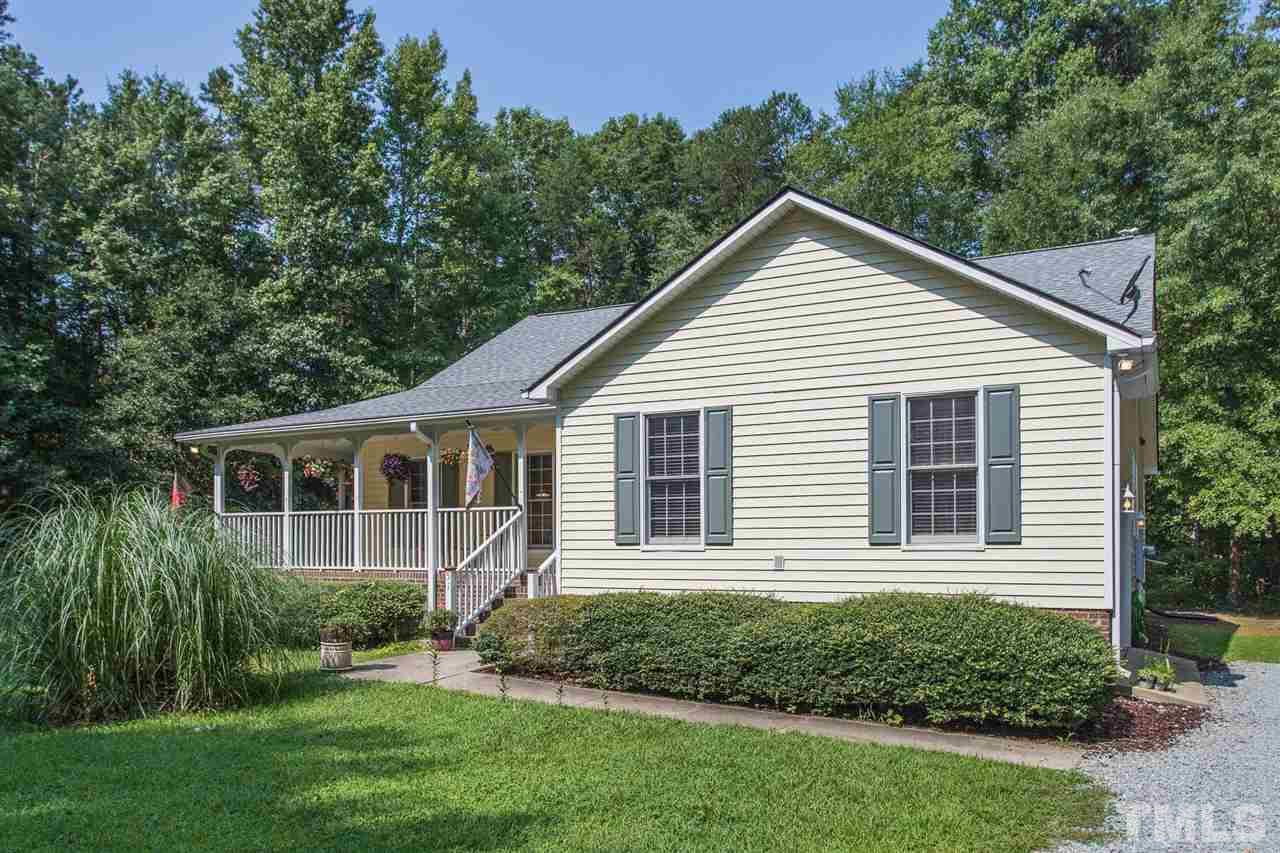 51 Hunters Lane Timberlake, NC 27583 - Photo 30 of 30 a view of a house with a yard and potted plants