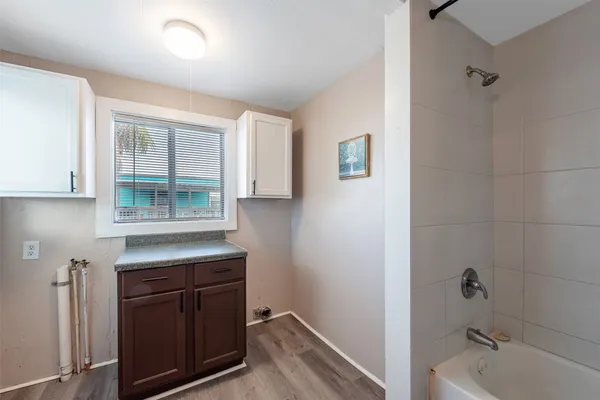 a bathroom with a sink and a bathtub