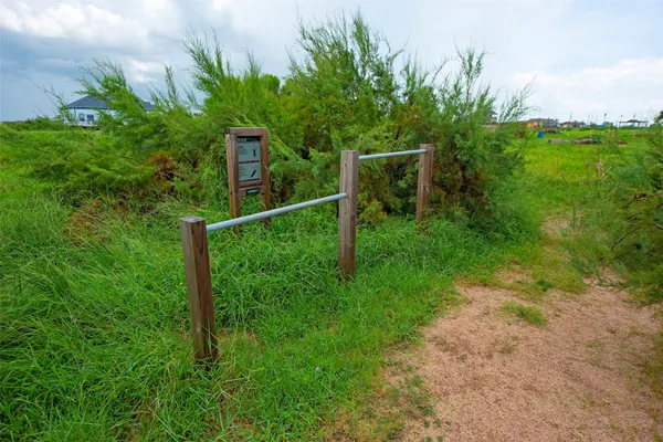 a view of a park with a sign board