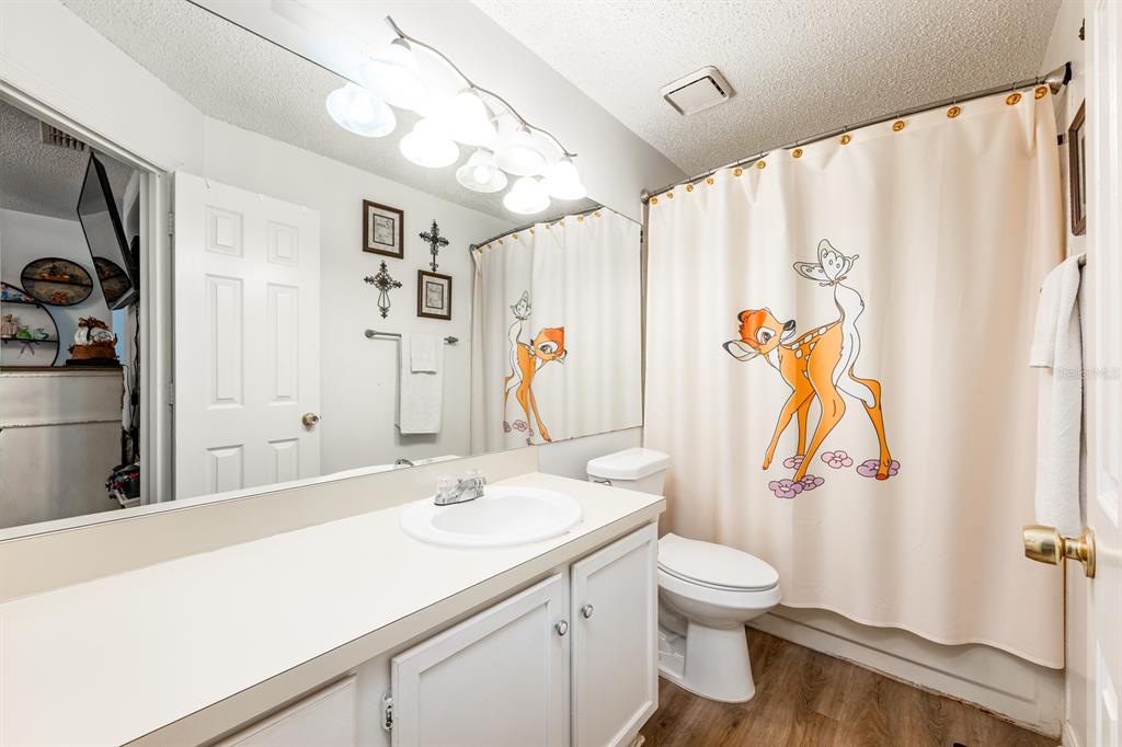 954 Forest Ridge Court, Unit 106 Lake Mary, FL 32746 - Photo 11 of 20 a bathroom with a sink toilet and shower