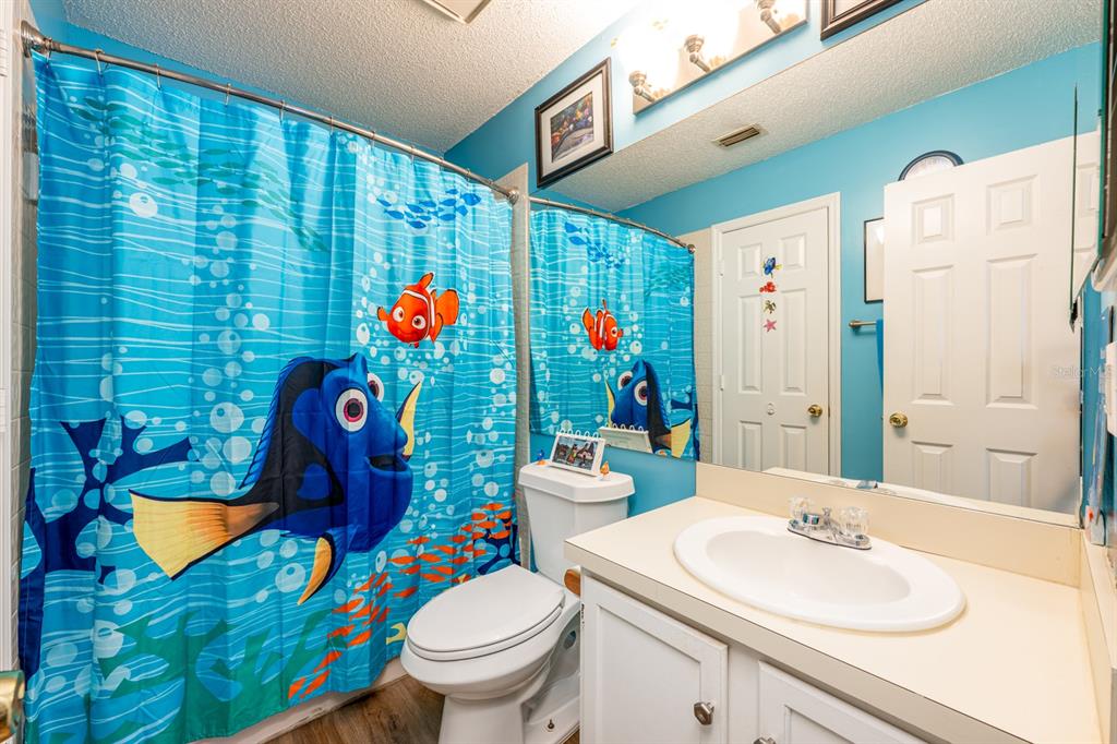 954 Forest Ridge Court, Unit 106 Lake Mary, FL 32746 - Photo 14 of 20 a bathroom with a sink mirror vanity and toilet
