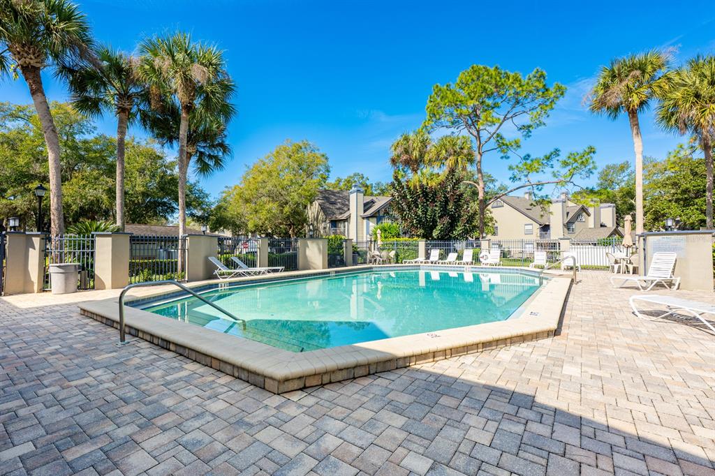 954 Forest Ridge Court, Unit 106 Lake Mary, FL 32746 - Photo 18 of 20 a view of a swimming pool with a patio