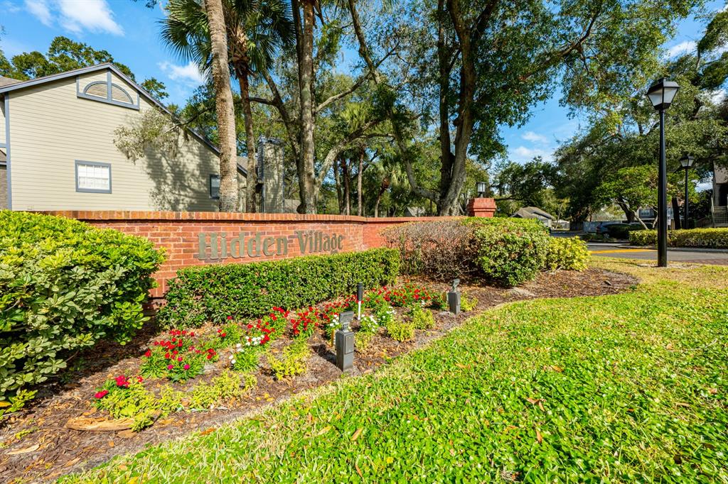 954 Forest Ridge Court, Unit 106 Lake Mary, FL 32746 - Photo 20 of 20 a view of backyard with a garden