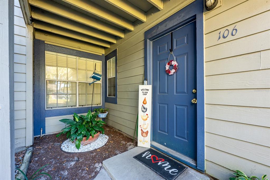 954 Forest Ridge Court, Unit 106 Lake Mary, FL 32746 - Photo 2 of 20 a front view of a house with a potted plant