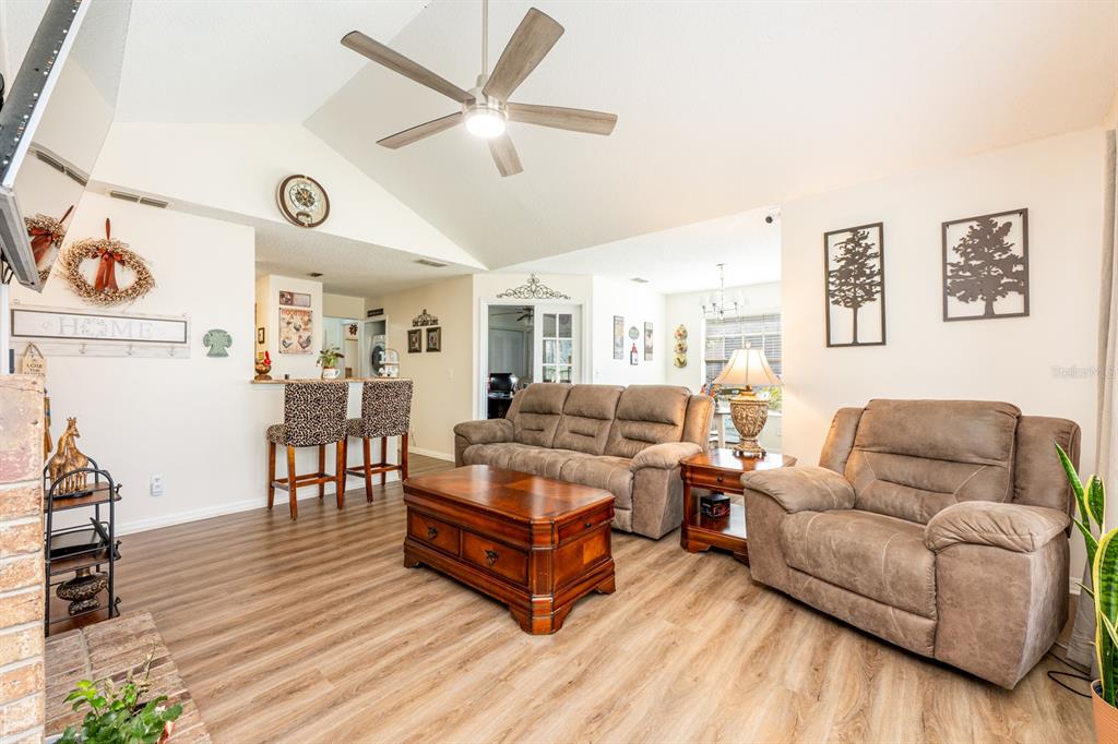 954 Forest Ridge Court, Unit 106 Lake Mary, FL 32746 - Photo 4 of 20 a living room with furniture and wooden floor