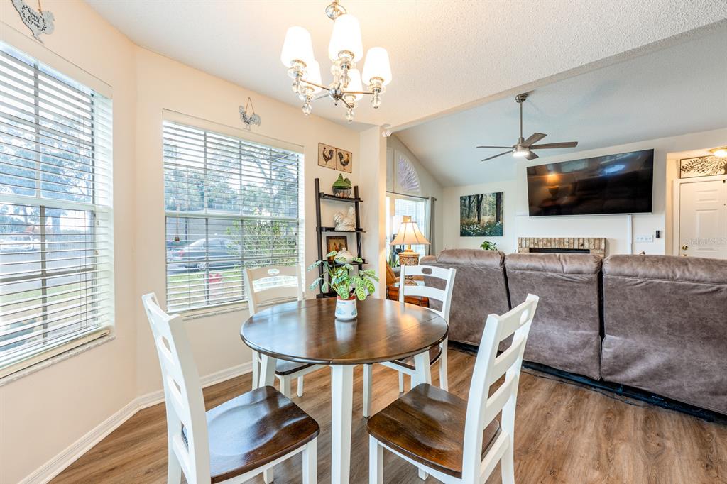 954 Forest Ridge Court, Unit 106 Lake Mary, FL 32746 - Photo 6 of 20 a view of a dining room with furniture window and wooden floor