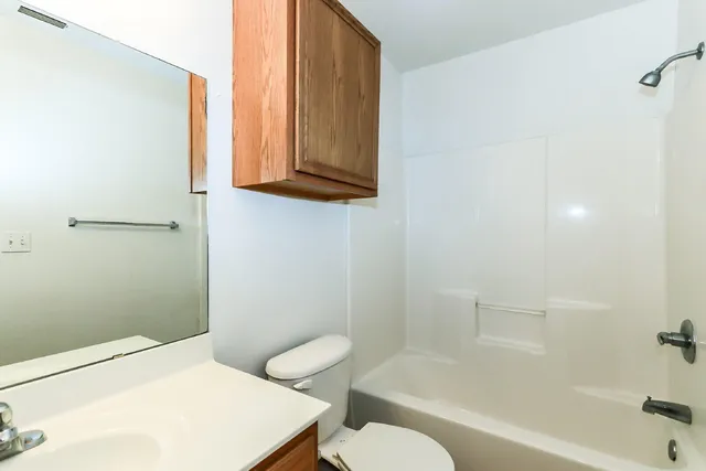 a bathroom with a toilet a sink and bathtub