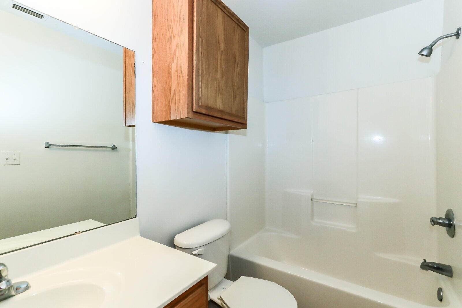 606 North Englewood Avenue, Unit A Lubbock, TX 79416 - Photo 13 of 19 a bathroom with a toilet a sink and bathtub