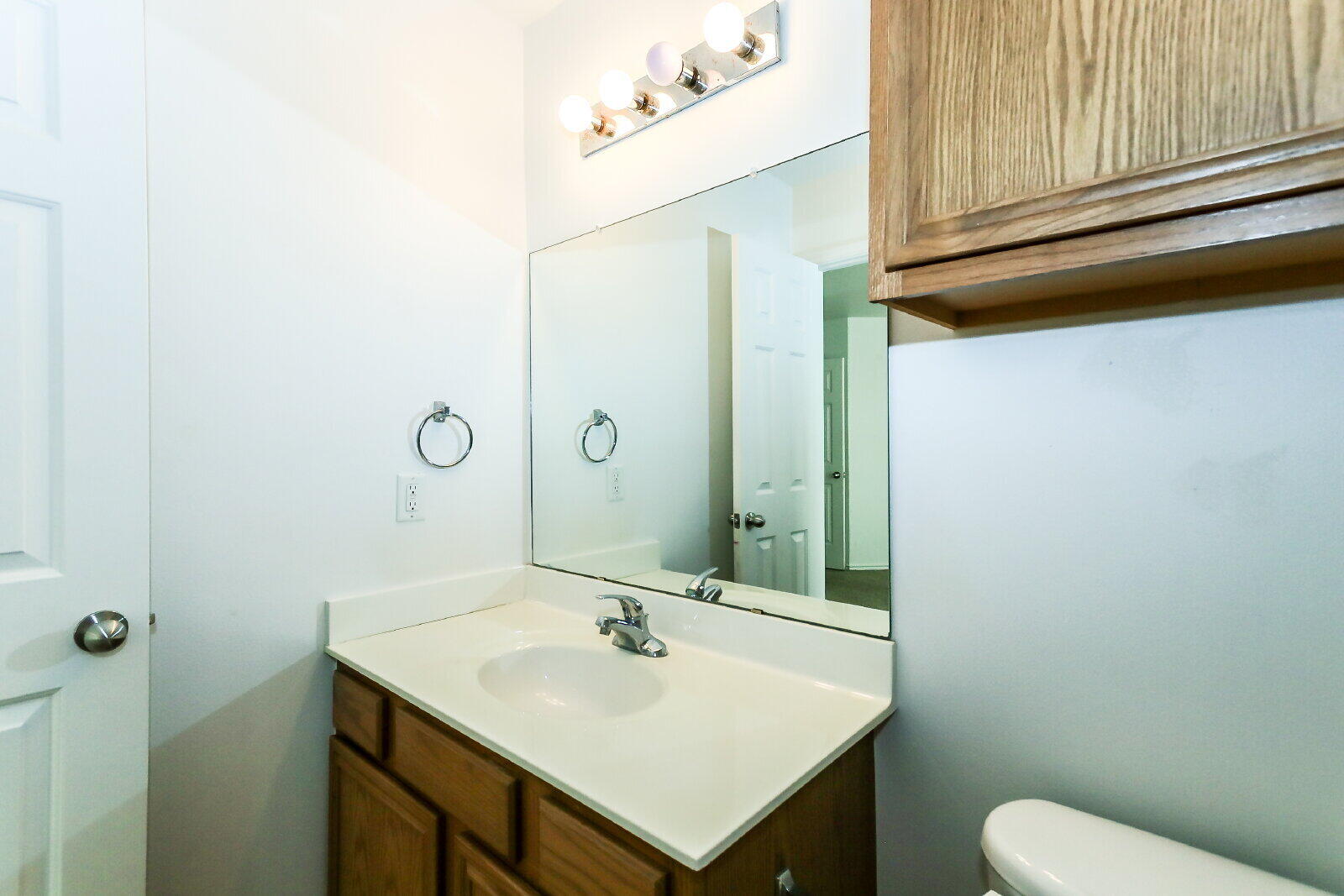 606 North Englewood Avenue, Unit A Lubbock, TX 79416 - Photo 15 of 19 a bathroom with a sink and a mirror