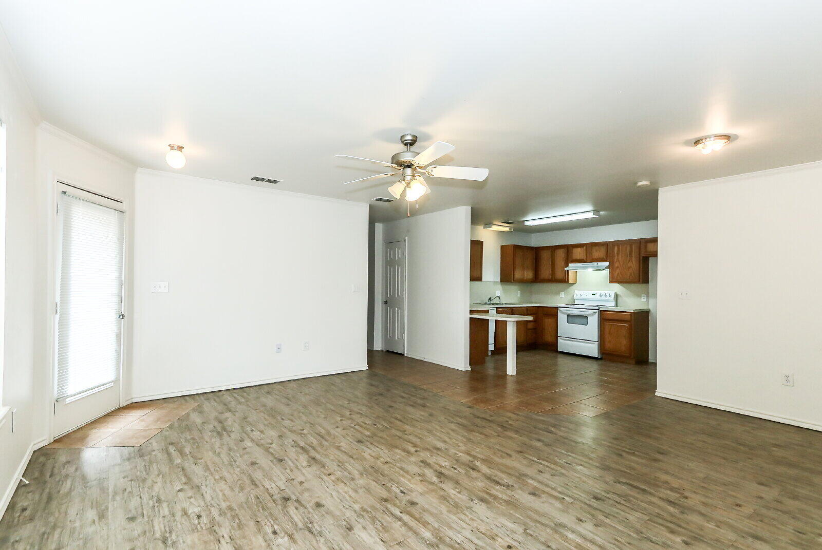 606 North Englewood Avenue, Unit A Lubbock, TX 79416 - Photo 2 of 19 a view of a kitchen with a sink stainless steel appliances and cabinets