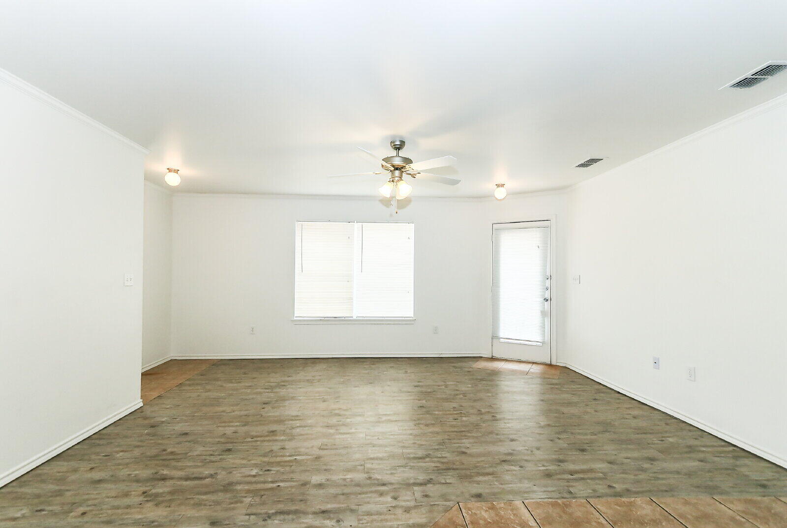 606 North Englewood Avenue, Unit A Lubbock, TX 79416 - Photo 6 of 19 wooden floor in an empty room