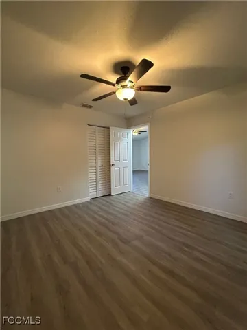 a view of an empty room and wooden floor