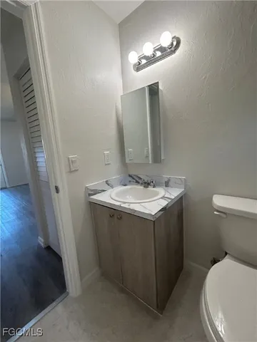 a view of wooden balcony with a floor to ceiling window