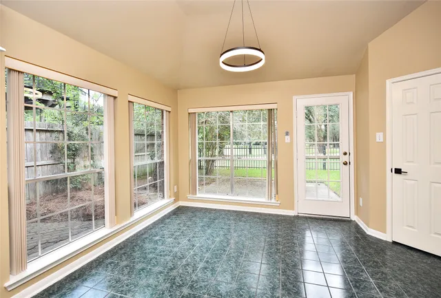 a view of an empty room with a window