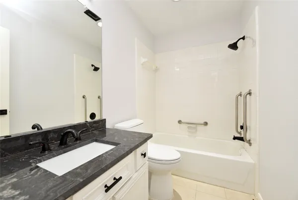 a bathroom with a sink a toilet and a bathtub