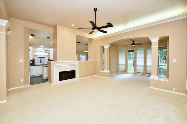 a view of a livingroom with a fireplace and cabinet