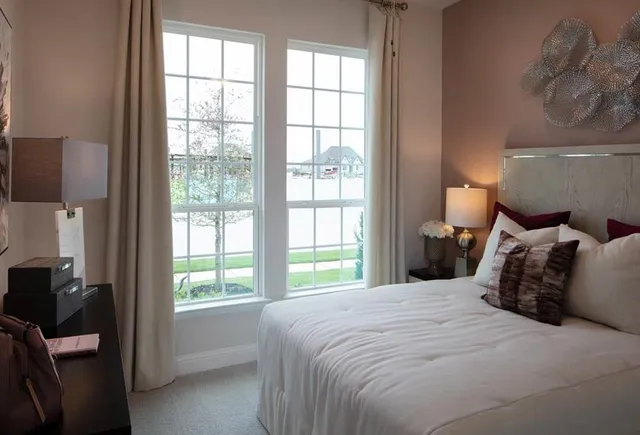 a view of a lake with houses in the back