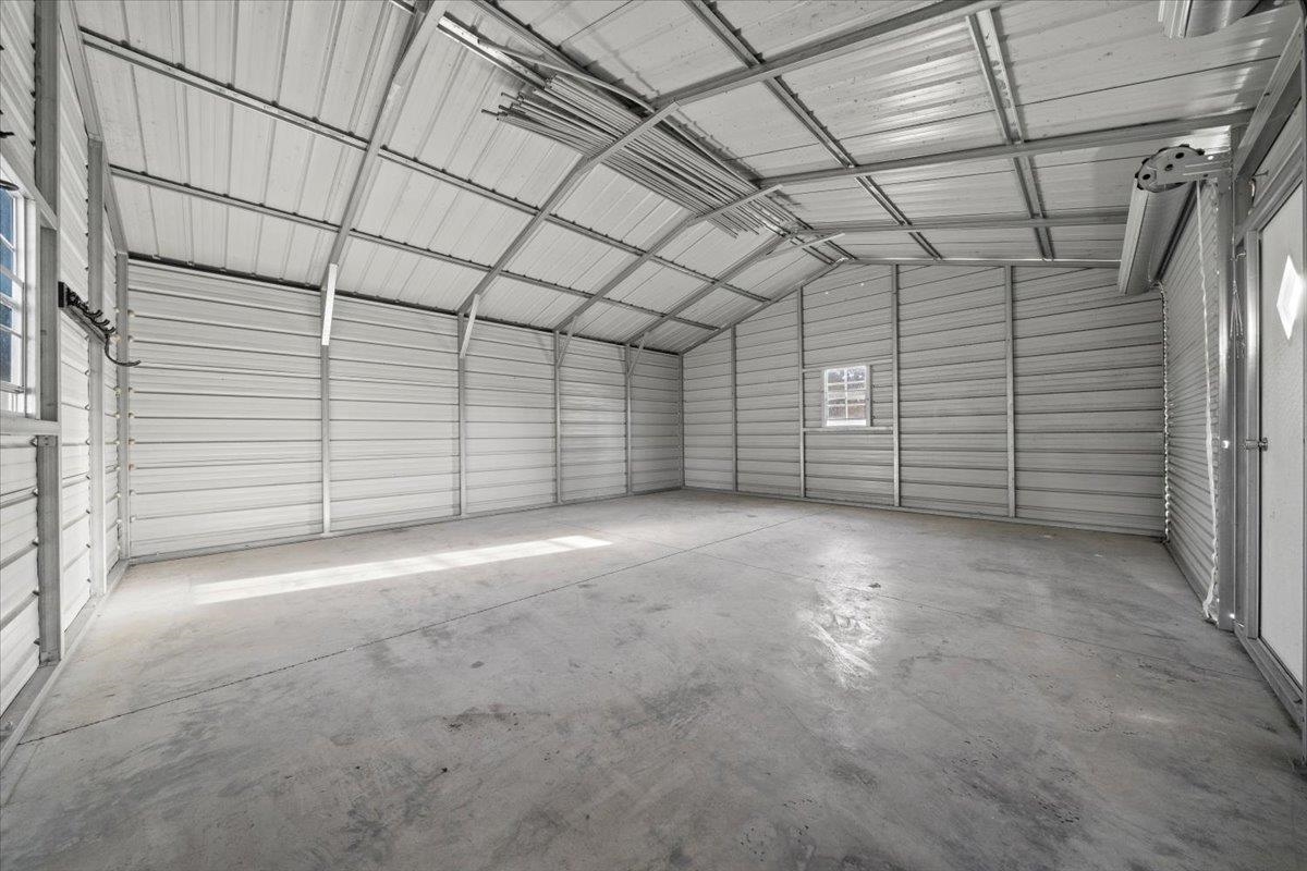 9496 Holly Grove Road Brighton, TN 38011 - Photo 26 of 29 Garage featuring metal wall