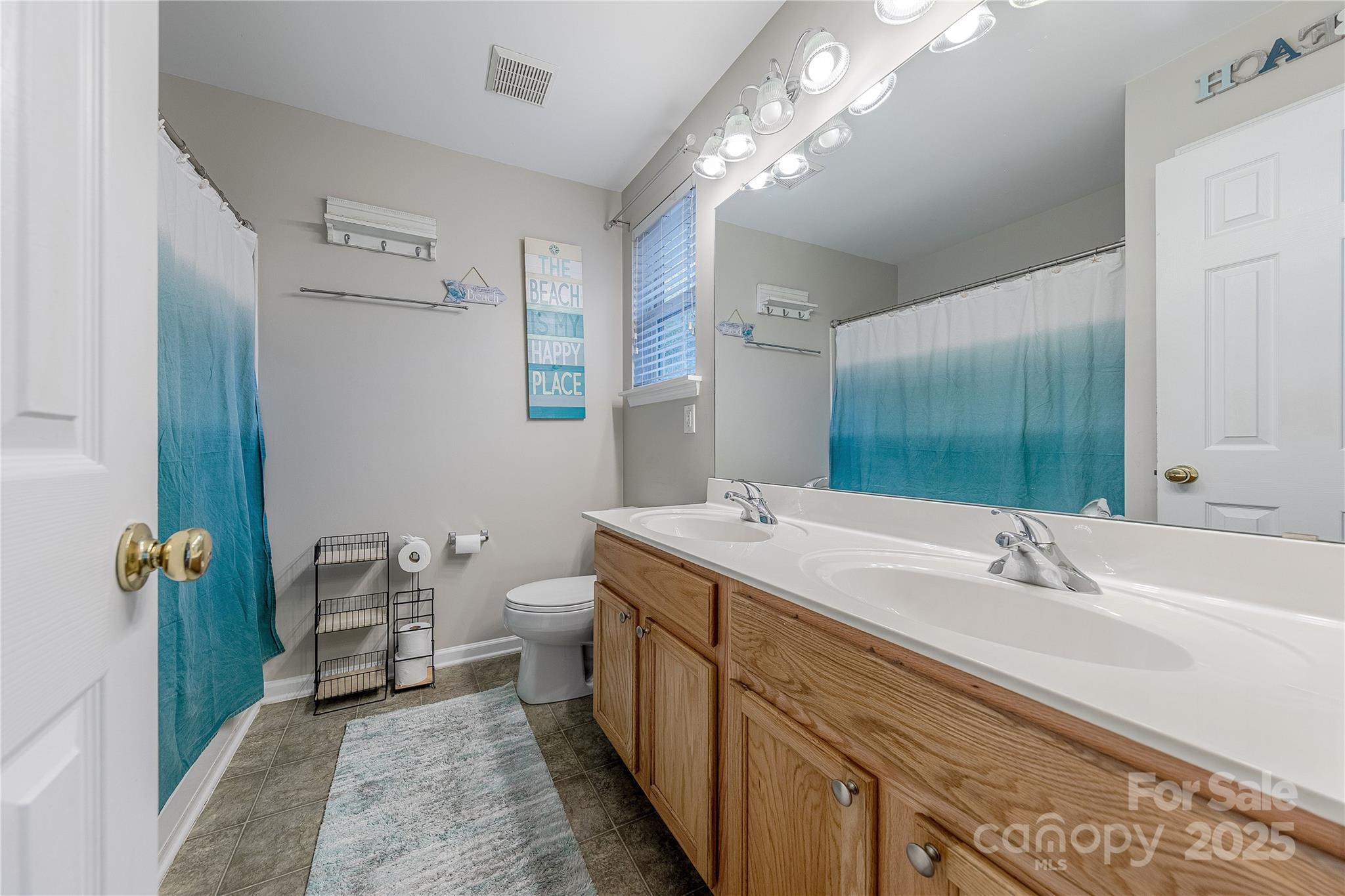 1581 Maypine Commons Way Rock Hill, SC 29732 - Photo 11 of 16 a spacious bathroom with a double vanity sink and a mirror