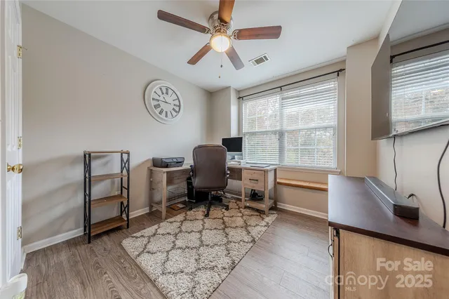 a workspace with furniture and a window